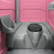 A PolyJohn pink portable restroom with a sink and black lid.