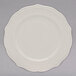 A 10 Strawberry Street Ever white porcelain plate with a scalloped edge.