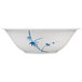 A white bowl with blue bamboo leaf designs.