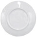 A white plate with a wavy circular edge.