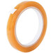 A roll of Shurtape orange cellulose film tape on a white background.