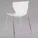 A Flash Furniture Lowell white plastic chair with metal legs.