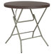 A Flash Furniture round brown rattan plastic folding table with a metal frame.