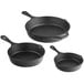 A group of Valor pre-seasoned cast iron skillets on a white background.