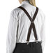 A person wearing Henry Segal brown clip-end suspenders and a white shirt.