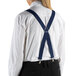 A woman wearing navy Henry Segal clip-end suspenders over a white shirt and black pants.