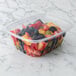 A rectangular Eco-Products plastic deli container filled with fruit.
