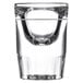 A close up of a clear Libbey fluted shot glass with a white stripe at the bottom.