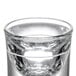 A clear Libbey fluted shot glass with a small hole in it.