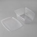 A clear plastic Eco-Products rectangular deli container with a lid.