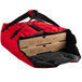 A red Cambro insulated pizza delivery bag with two pizza boxes inside.