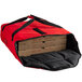 A red Cambro Insulated Pizza Delivery GoBag with two pizza boxes inside.