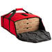 A red Cambro insulated pizza delivery bag with two pizza boxes inside.