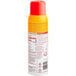 A Vegalene Zesty Garlic Mist spray bottle with red and yellow labels.