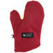 A red oven mitt with a white label.