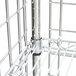 A white metal Metro wine rack with wire shelves and metal bars.
