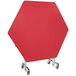 A red hexagon shaped National Public Seating cafeteria table with wheels.