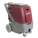 A red and gray Minuteman Rush 100 carpet extractor with wheels.