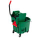 A green Rubbermaid® mop bucket with a handle and wheels.