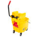 A yellow Rubbermaid WaveBrake mop bucket with a red side press wringer.