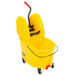 A yellow Rubbermaid mop bucket with a handle and down press wringer.