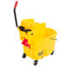 A yellow Rubbermaid WaveBrake mop bucket with a side press wringer.