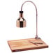 A Cres Cor portable carving station with a lamp on a maple wood cutting board.