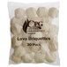 A bag of white round lava briquettes with the words "Cooking Performance" on it.