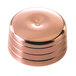 A close up of a copper-plated shaker cap on a table.