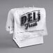 A Choice Deli saddle bag stand filled with white plastic bags printed with "Deli Fresh" in black.