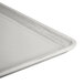 A taupe Cambro dietary tray with a metal handle.