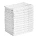 A stack of white Lavex bath mats.
