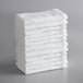 A stack of white Lavex cotton washcloths.