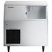 A silver Hoshizaki undercounter ice machine with a clear door open.