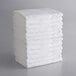 A stack of white Lavex cotton bath towels.