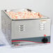 An APW Wyott countertop food warmer with a large stainless steel container of shrimp inside.