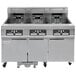 A Frymaster commercial electric floor fryer with three units.