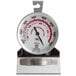 A round metal Comark oven thermometer.