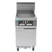 A Frymaster gas floor fryer with stainless steel panels.