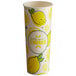A white paper cup with lemons and limes on it.