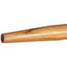 A Carlisle wood broom/squeegee handle with a tapered end.