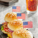 Three burgers with Royal Paper American flags on them.