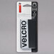 A black rectangular package with white text containing 2 black Velcro Industrial Strength hook and loop fasteners.