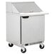 A Beverage-Air stainless steel refrigerated sandwich prep table with a door on wheels.