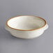 A white bowl with a brown rim.
