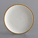 An Acopa Keystone stoneware coupe plate in white with brown specks.