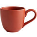A close up of a red Libbey Driftstone mug.