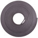 A roll of black Zeus adhesive magnetic label tape.
