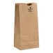 A brown Duro paper bag with black text.
