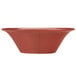 A Libbey round barn red porcelain soup bowl with a white background.